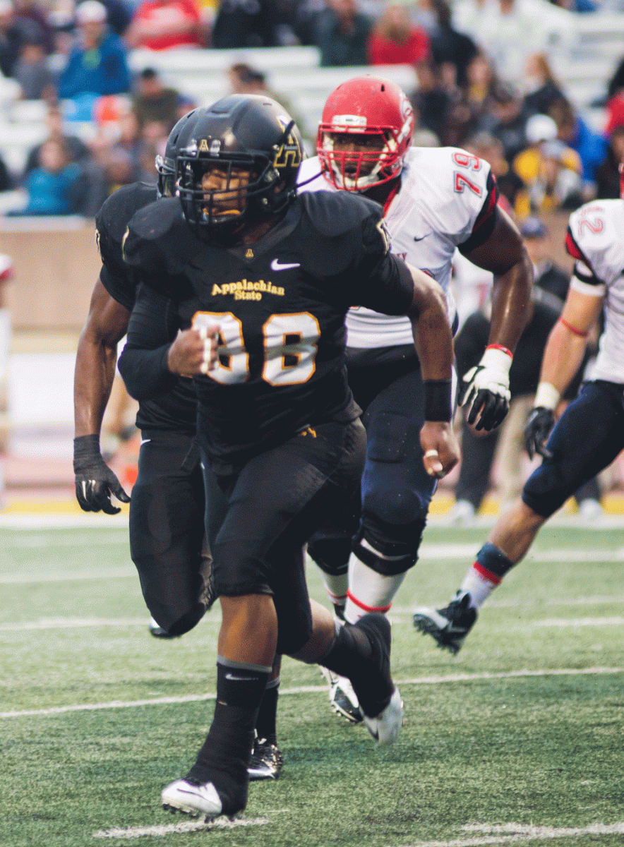 Inside linebacker John Law runs down the field during the App State vs. Liberty game on Oct. 11, 2014. 