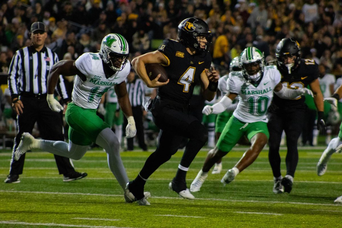 Quarterback Joey Aguilar runs the ball down the field at the App State vs. Marshall game at Kidd Brewer Stadium on Nov. 4, 2023.