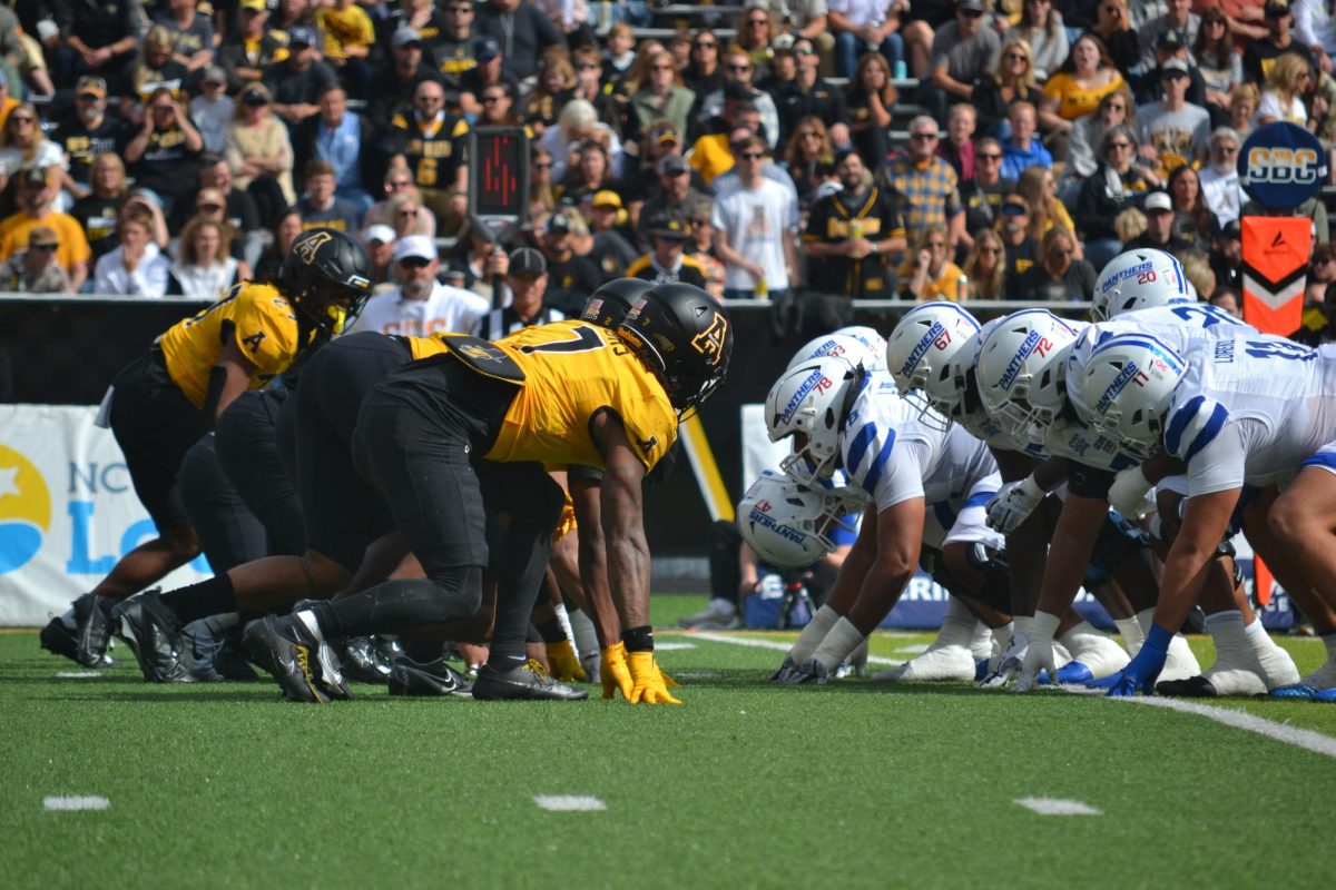 The App State football team prepares for a play against Georgia State on Oct. 26.