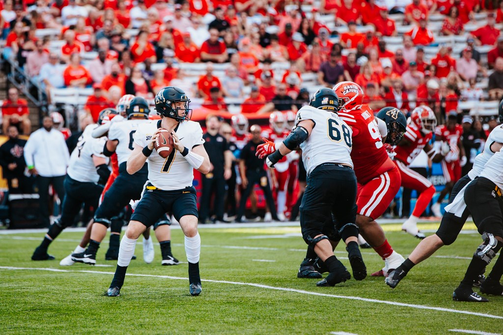 Quarterback Chase Brice prepares to pass the ball at the App State vs. Louisiana game on Dec. 4, 2021. 