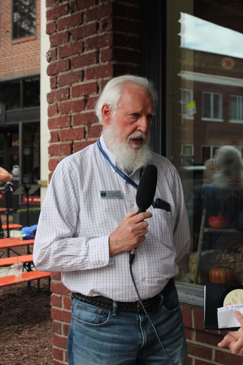 County Commissioner Larry Turnbow talks about the devastation of Hurricane Helene in Boone outside the Mast General Store on Oct. 3. 