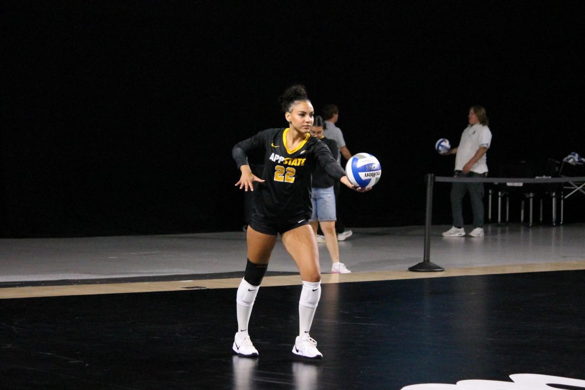 Defensive specialist Taylor McNear prepares to serve the ball at the App State vs. Winthrop game on Sept. 13