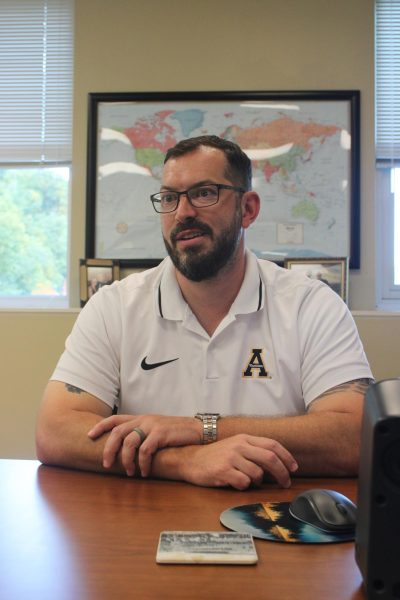 Director of University Housing Brandon Nelson in his office in John E. Thomas Hall on Sept. 20.