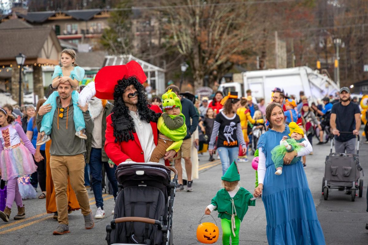 A family of five walks down Main Street in their Peter Pan costumes during Blowing Rocks Monster March on Oct. 26. Courtesy of Tyler Graves