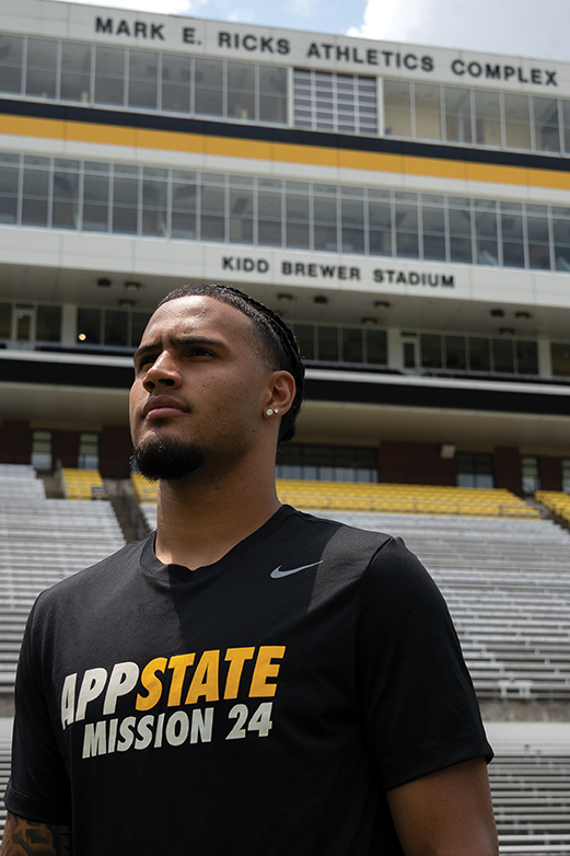 Wide receiver Kaedin Robinson looks over Kidd Brewer Stadium before the start of the 2024 season.