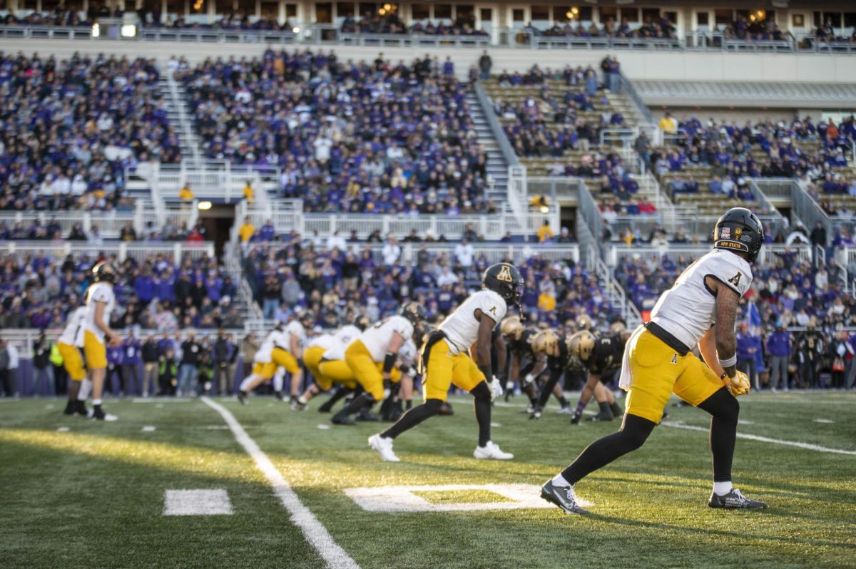 App State lines up to begin a play against James Madison at Bridgeforth Stadium on Nov. 18, 2023.