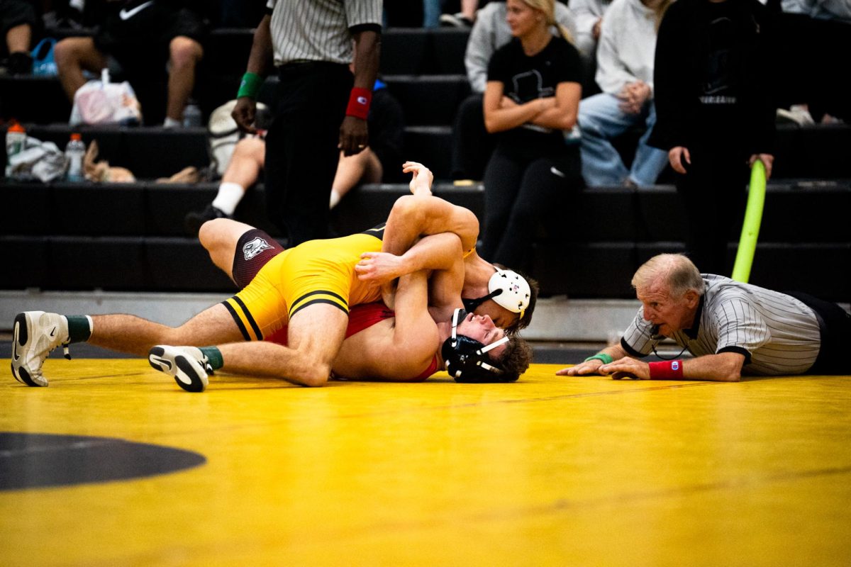 Redshirt sophomore 149-pound Kaden Keiser takes down his opponent at the Mountaineer Invitational on Nov. 9. 