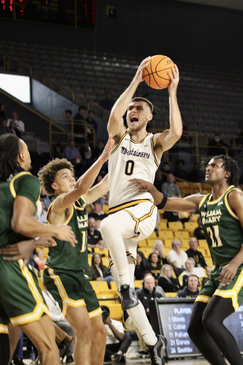 Guard Jackson Threadgill goes for a jumper against William & Mary on Nov. 24. Threadgill earned the team 7 points during this game, totaling 39 for the season so far.