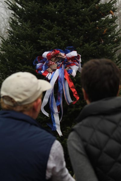 Ronnie Beam (left) and another attendee gaze at the tree before its cutting ceremony in Newland on Nov. 20.