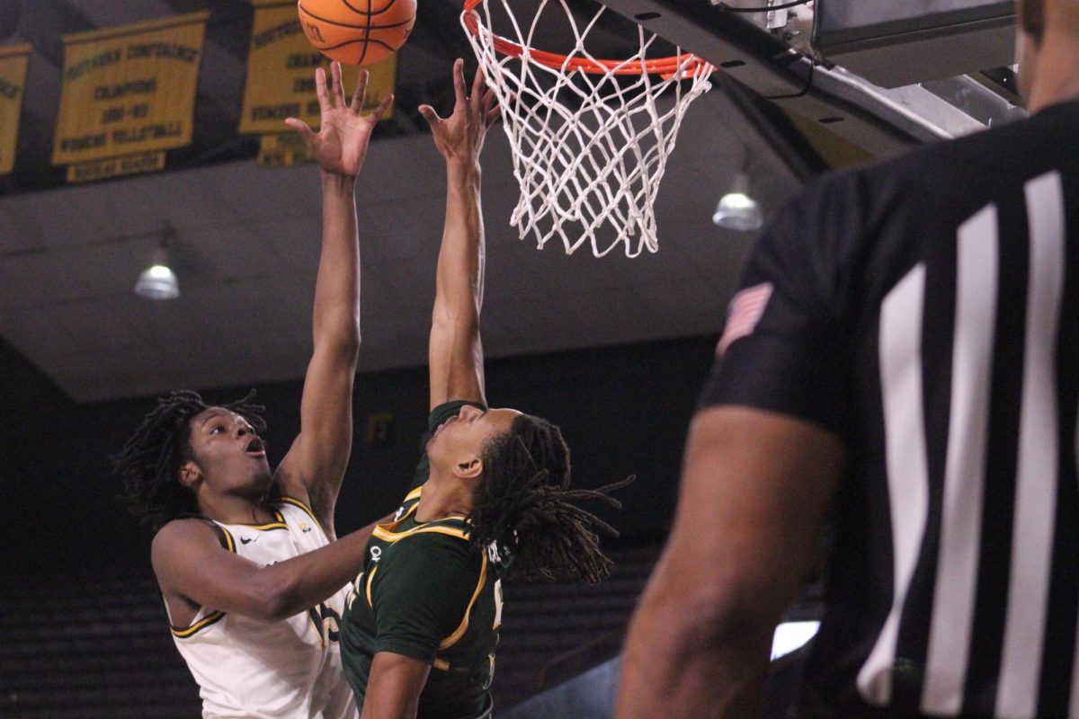 Graduate forward CJ Huntley goes for a layup during the App State vs. William & Mary game on Nov. 24.