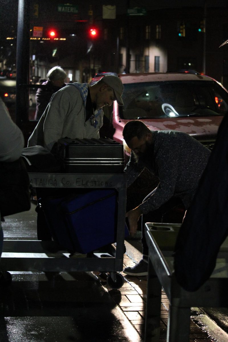 Poll workers deliver bags containing ballots and tabulators into the Watauga County Courthouse on Nov. 5. 