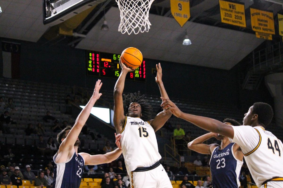 Forward CJ Huntley jumps to dunk against Queens on Nov. 19 at the Holmes Convocation Center. During the 2023-24 season, Huntley was named to the preseason All-Sun Belt third team.