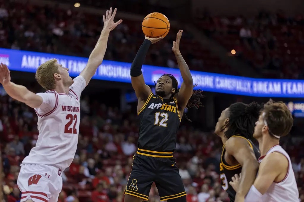 Redshirt senior guard Myles Tate goes for a shot against Wisconsin on Nov. 10