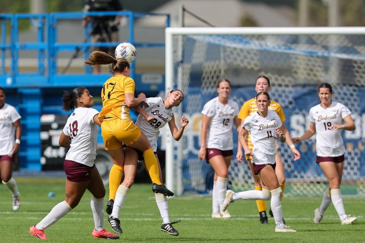 Freshman midfielder Walker Bristow jumps up to head-butt the ball during the match against Texas State on Nov. 4. Before attending App State, Bristow played for Richmond United.