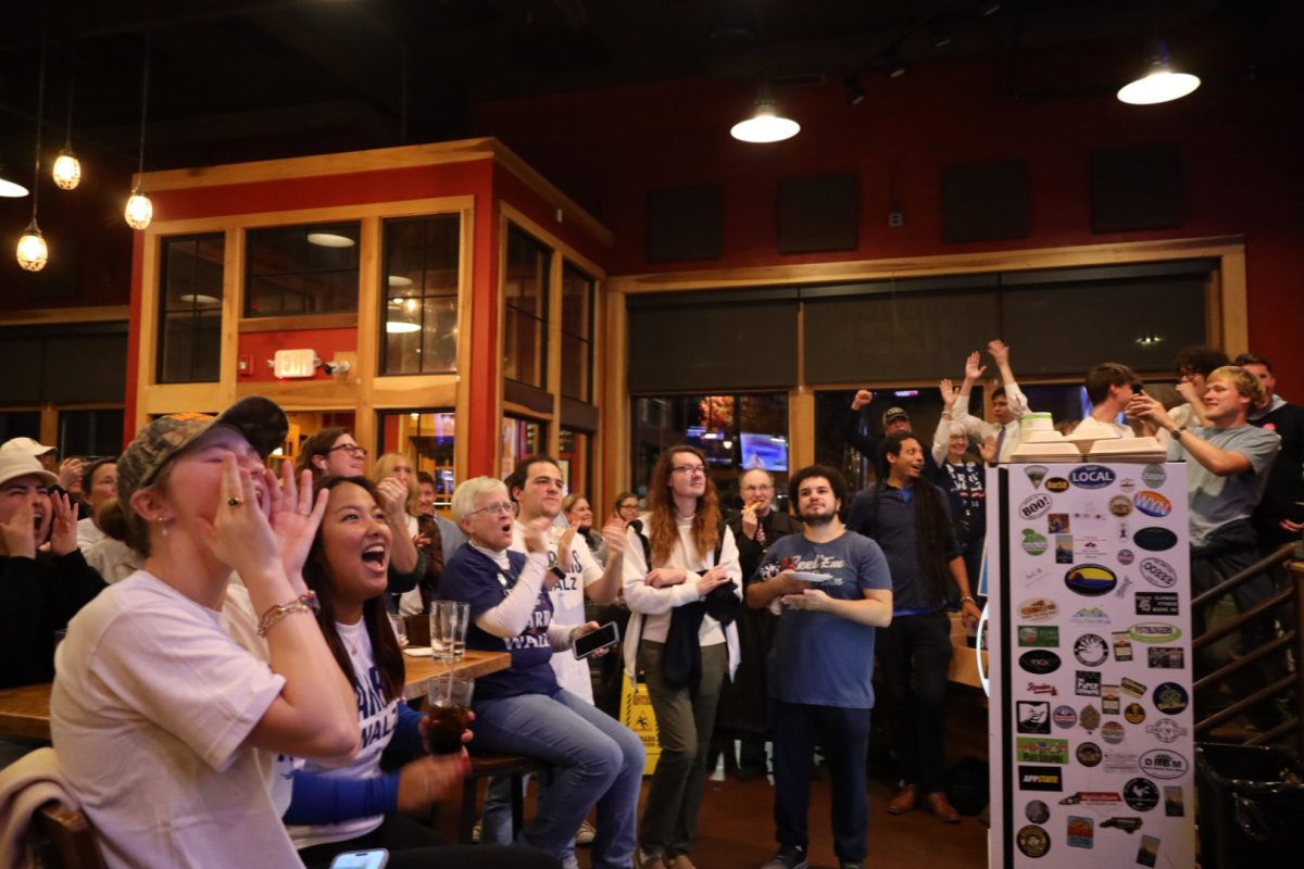 Attendees of the Democratic watch party at Lost Province Brewing Co., cheered while watching live updates from the election on Nov. 5.