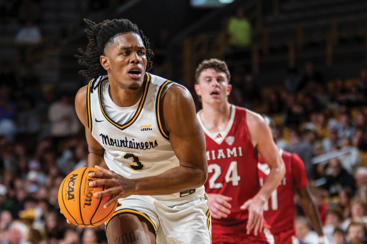 Redshirt freshman center Luke Wilson looks for a pass during the App State vs. Miami-Ohio RedHawks game on Nov. 4.