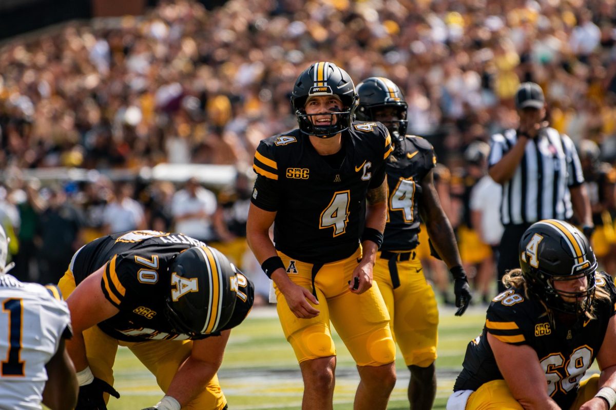 Quarterback Joey Aguilar prepares to catch a snap from his teammate at the start of a play against ETSU on Aug. 31.