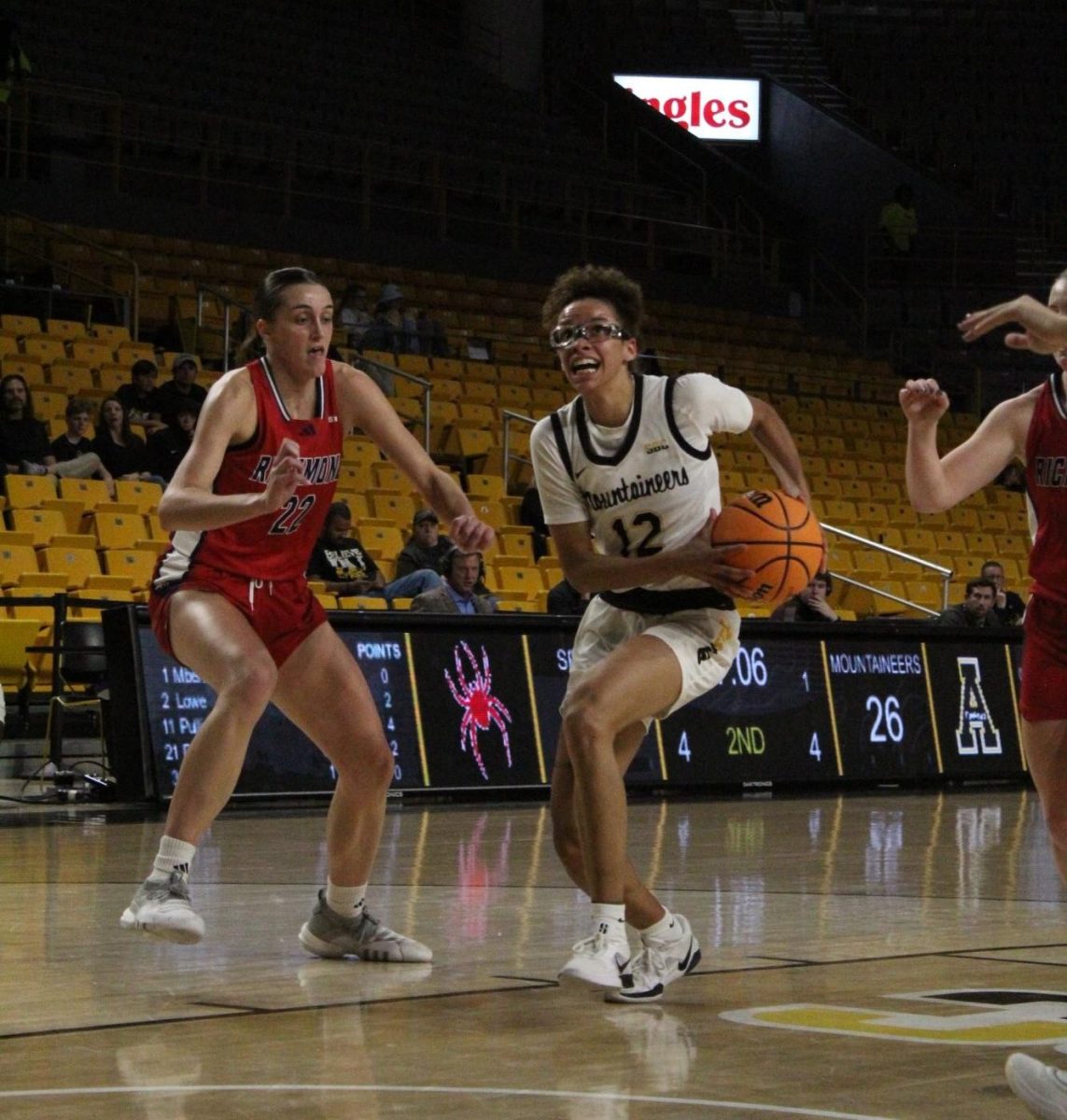 Senior guard Zada Porter drives toward the basket against Richmond guard Rachel Ullstrom at Holmes Convocation Center on Nov. 24.