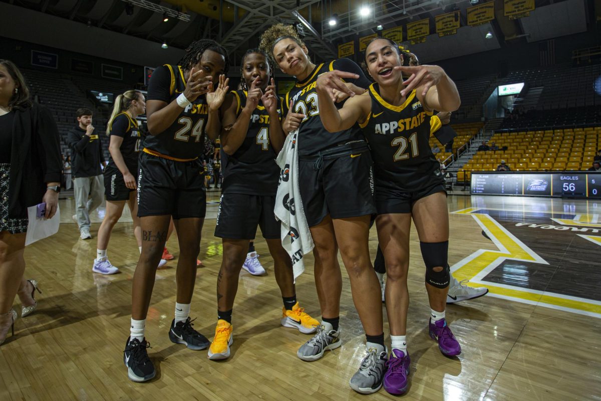 From left, senior guard Asjah Inniss, senior guard J’Mani Ingram, senior forward Samantha LaFon and senior guard Eleyana Tafisi celebrating after a win against Georgia Southern on Jan. 25.