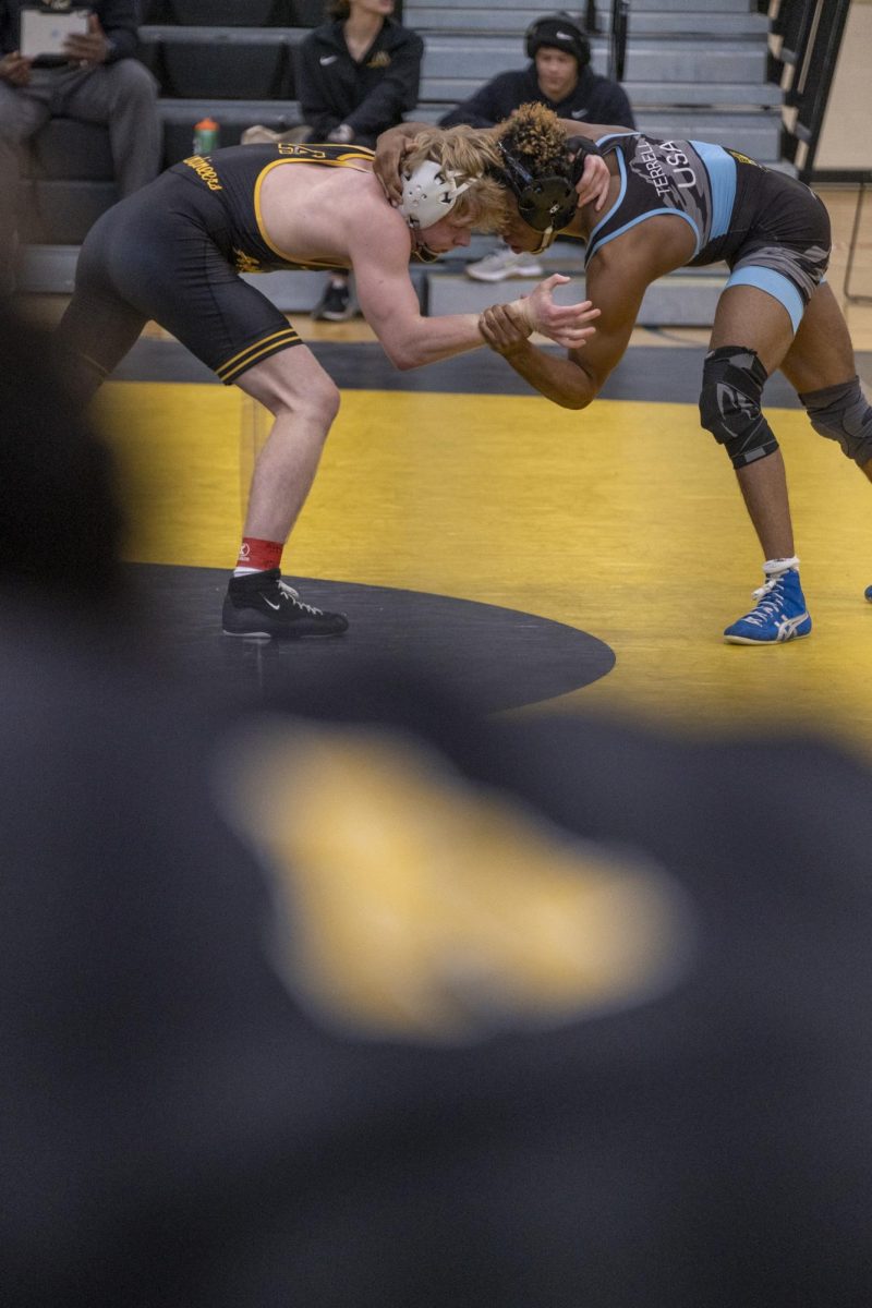 From left, 144-pound redshirt junior Riley Edwards and 133-pound freshman Jarvis Little arm-lock during the Appalachian Open on Jan. 25. Edwards went 4-0 on the day and won the Open title for his weight class.