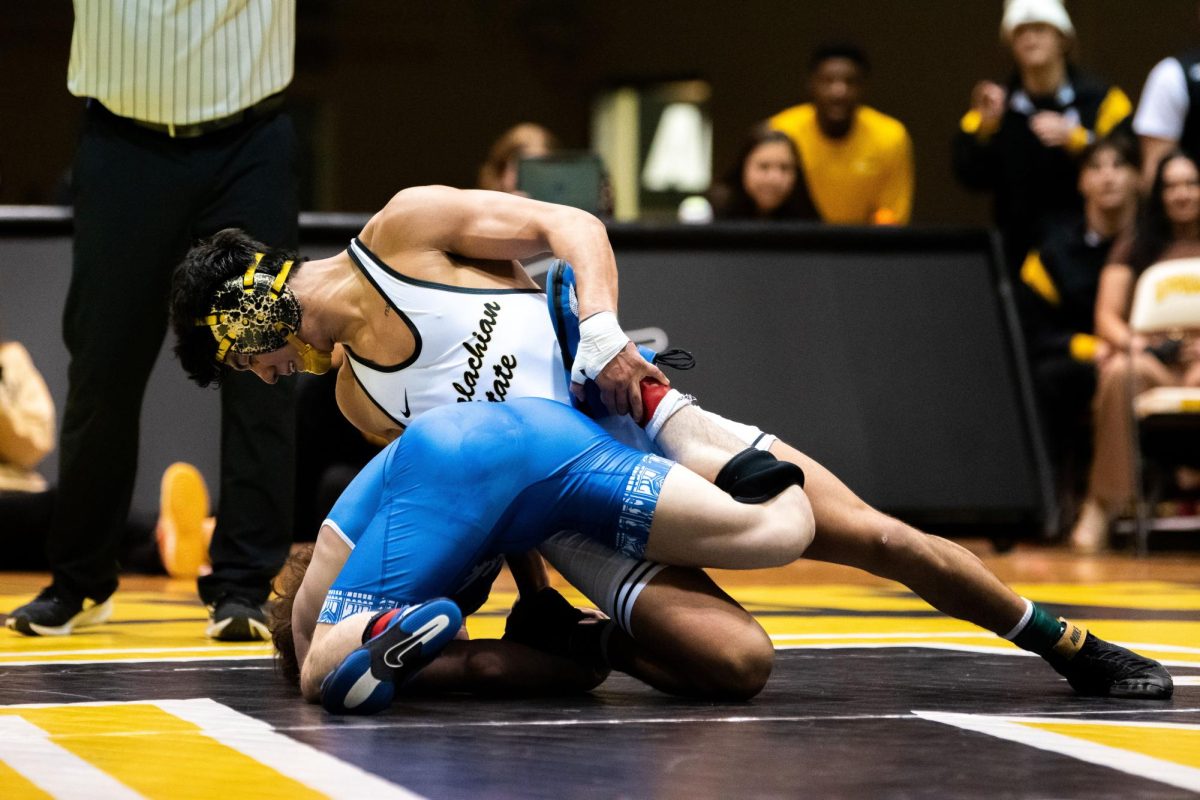 141-pound redshirt freshman Aldo Hernandez takes down his opponent in a winning match against Duke on Jan. 20. 