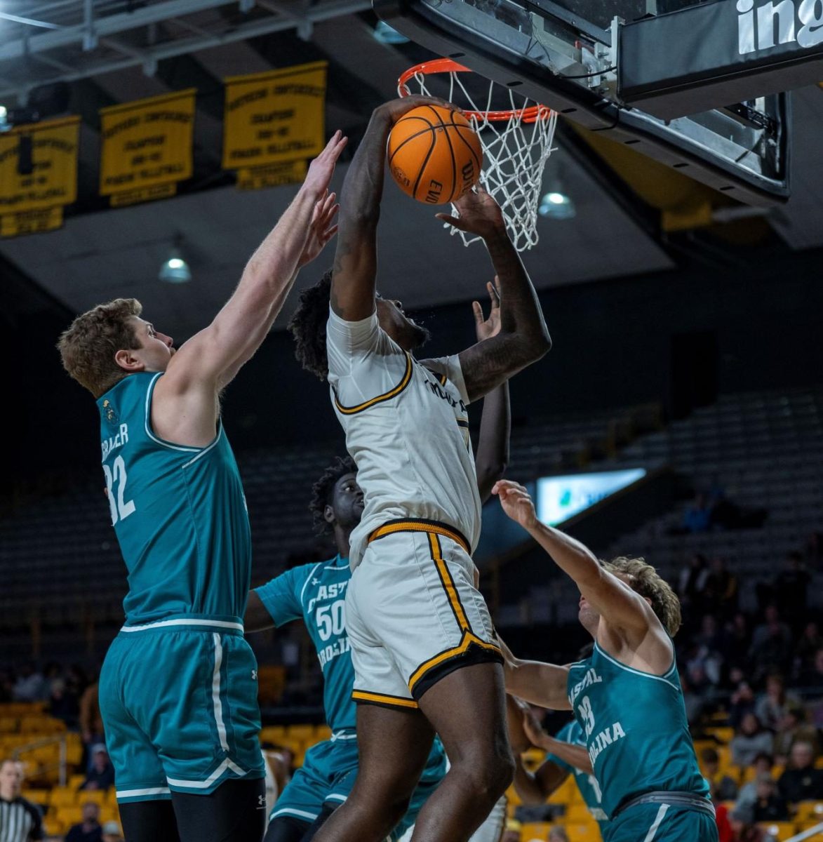 Senior forward Jalil Beaubrun jumps for a dunk against Coastal Carolina on Jan. 8.