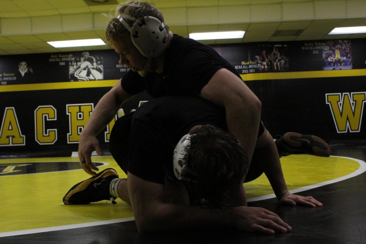 Senior 165-pound Will Miller tussles with teammates during practice in App State’s wrestling room in the Varsity Gym on Oct. 28.