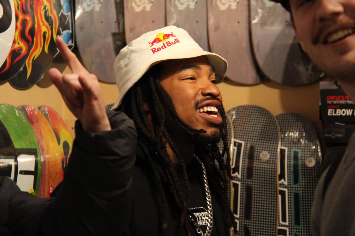 Snowboarder Zeb Powell laughs with fans at the meet and greet at Recess Skate and Snow on Jan. 15.