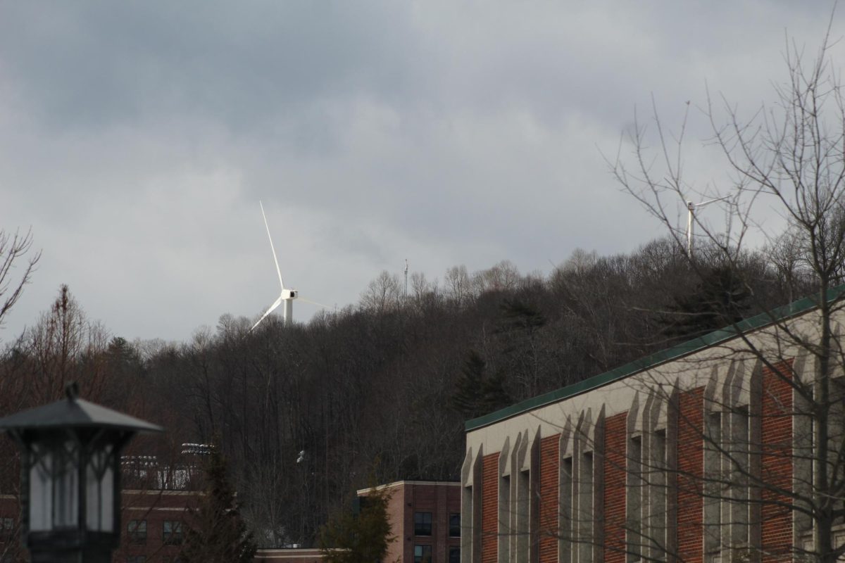 The smallest of the three wind turbines peeks over Belk Library, as seen from the Miles Annas Student Services Building on Jan. 24. 