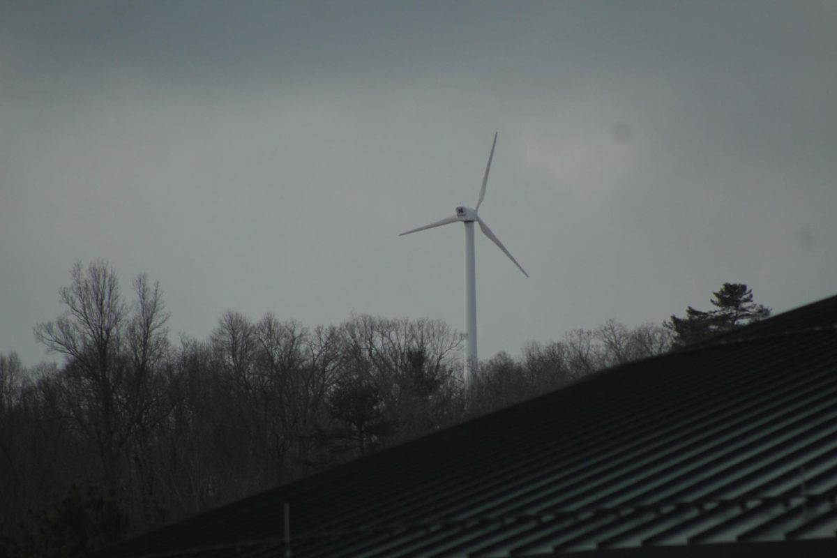 The smallest of the three wind turbines peeks over Belk Library, as seen from the Miles Annas Student Services Building on Jan. 24. 