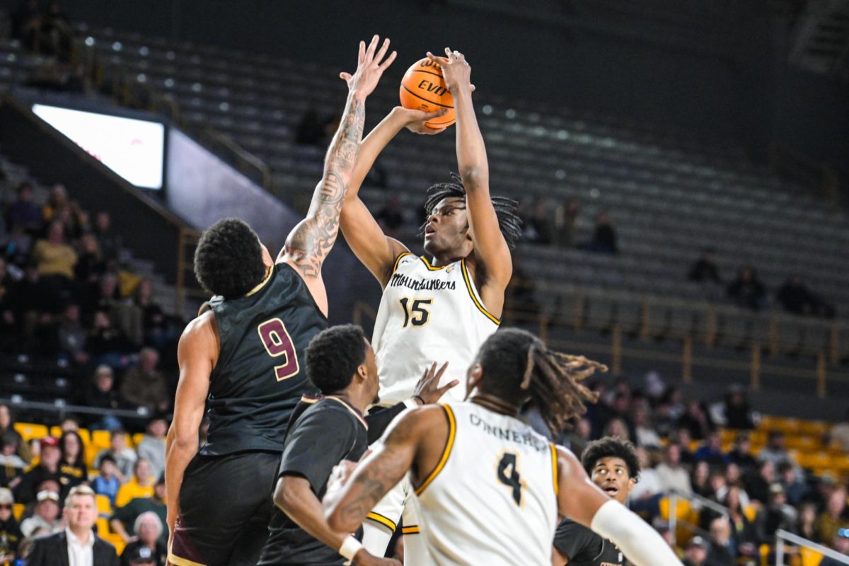 Graduate student forward CJ Huntley jumps to shoot the ball during the App State vs. Texas State game on Jan. 4.