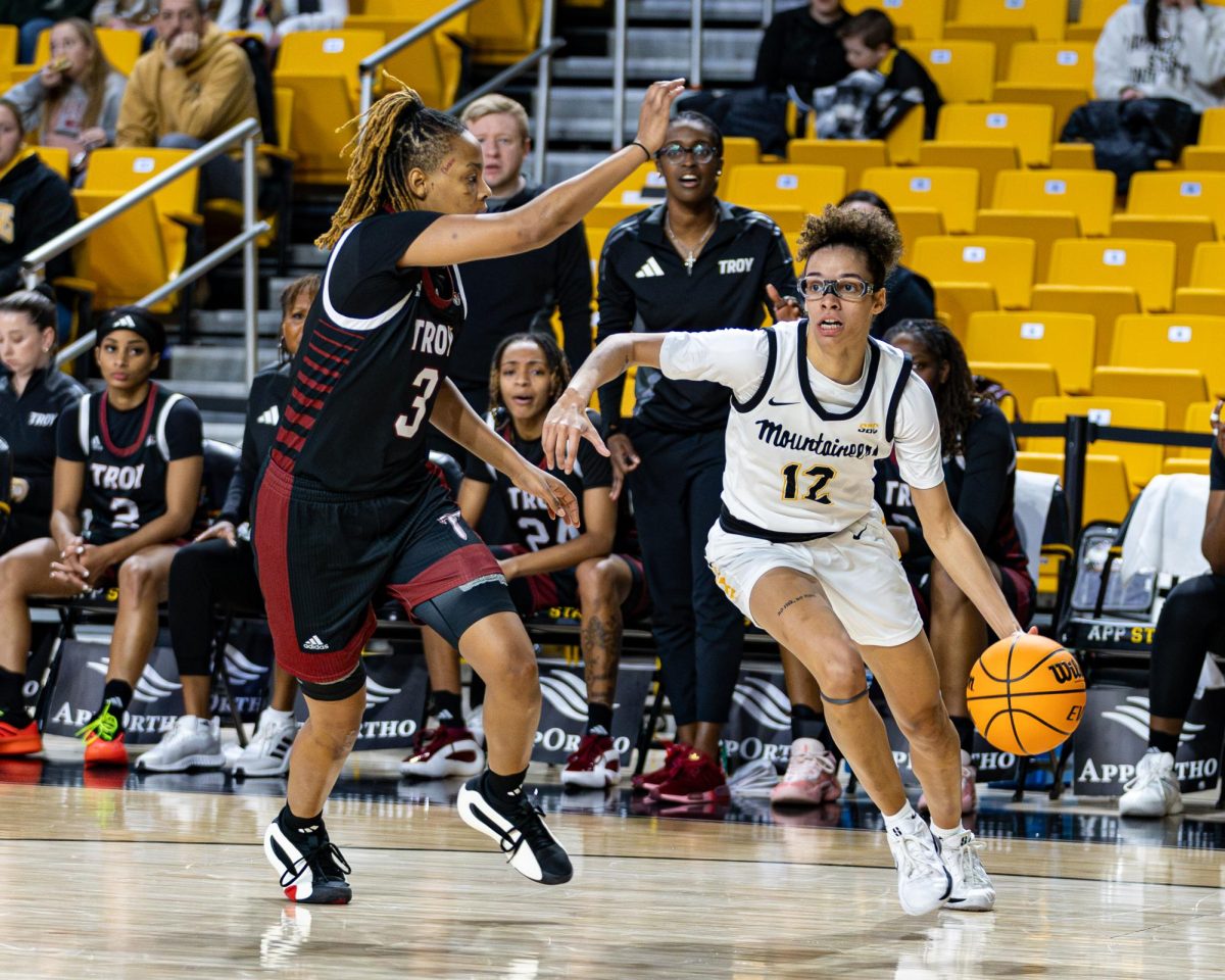 Senior guard Zada Porter blocking a Troy player as she dribbles past on Jan. 9.