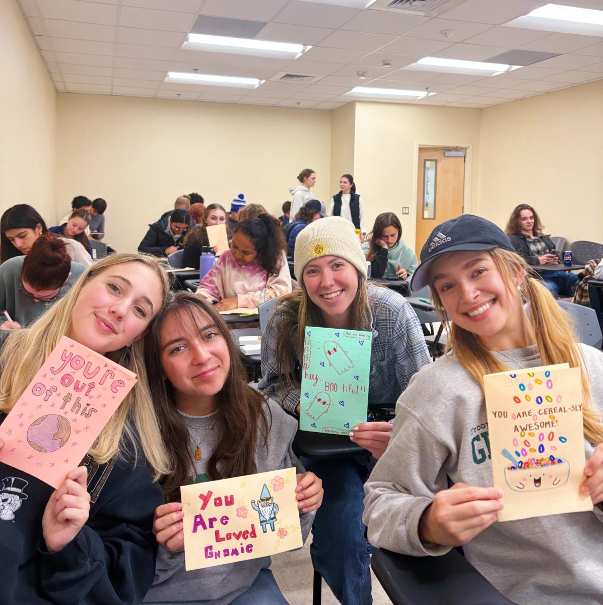 From left, members of Kappa Alpha Pi Fraternity, Inc. Kaylee Taylor, Emma Shelton, Ashley Bigelow and Sofie Mascellino collaborate with Letters of Love to create cards on Nov. 14. Courtesy of McKenna Carver.