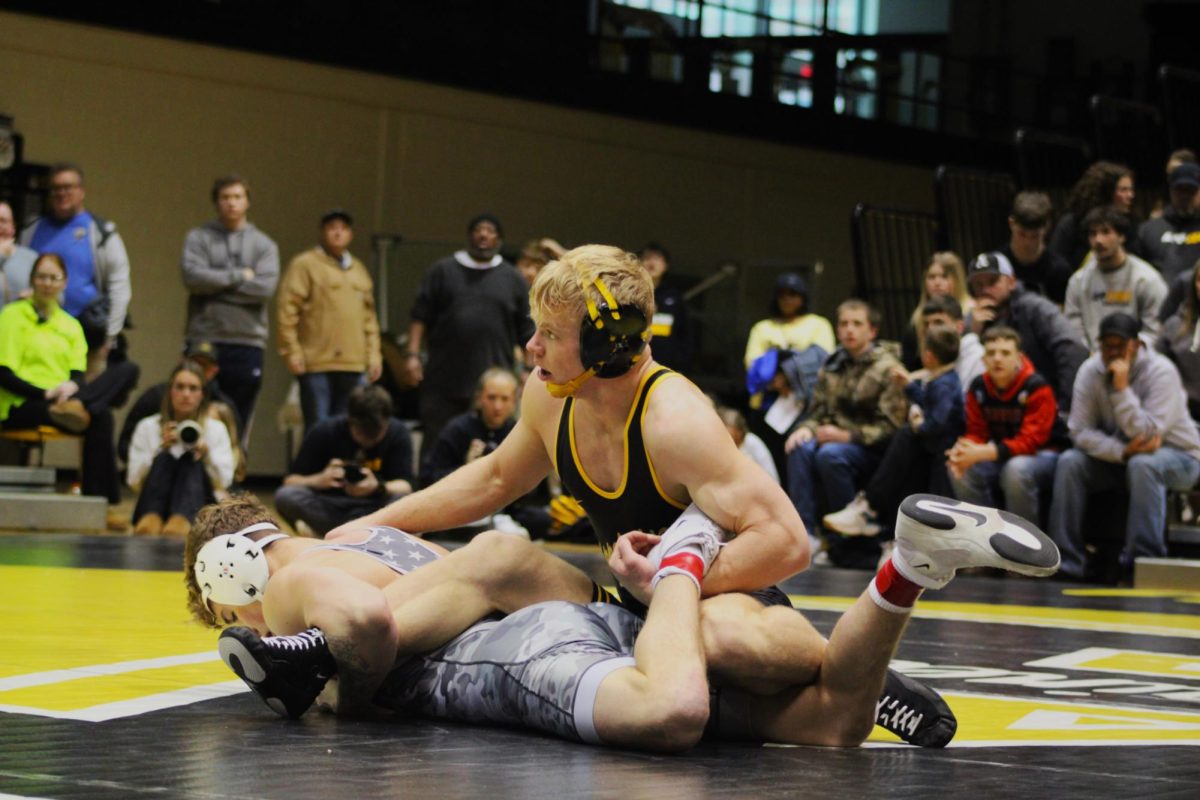 165-pound senior Will Miller with a takedown during a match against Virginia Tech on Jan. 19. Miller is currently ranked No. 8 in the country with 74 record wins in his App State career.