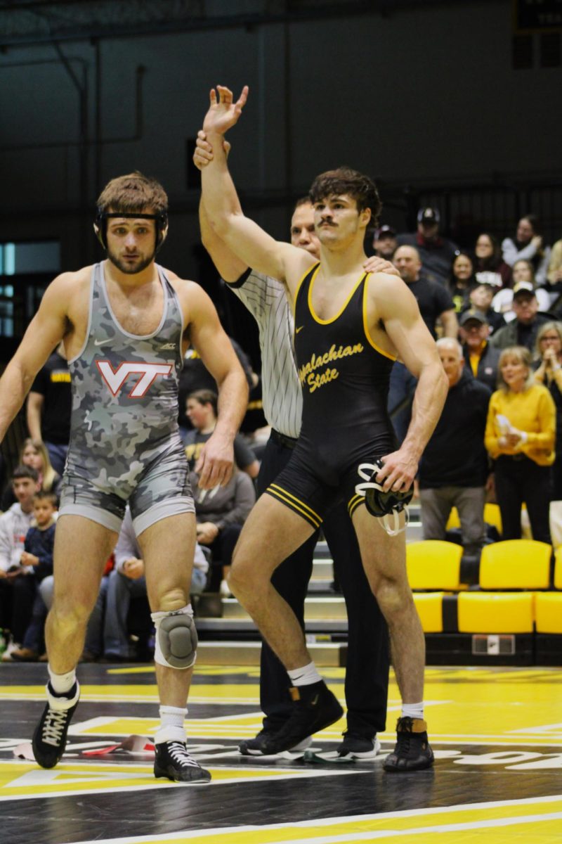 Redshirt junior Luke Uliano being declared the winner of his bout against Virginia Tech on Jan. 19. He currently holds a record of 46-31 in his time wrestling for App State.