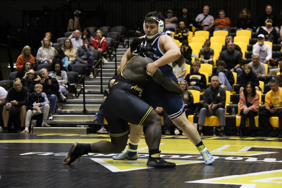 Freshman heavyweight Stephan Monchery fights for a single leg against Chattanooga’s Ethan Vergara at the Varsity Gym on Feb. 9. Monchery beat Vergara in a major decision win.