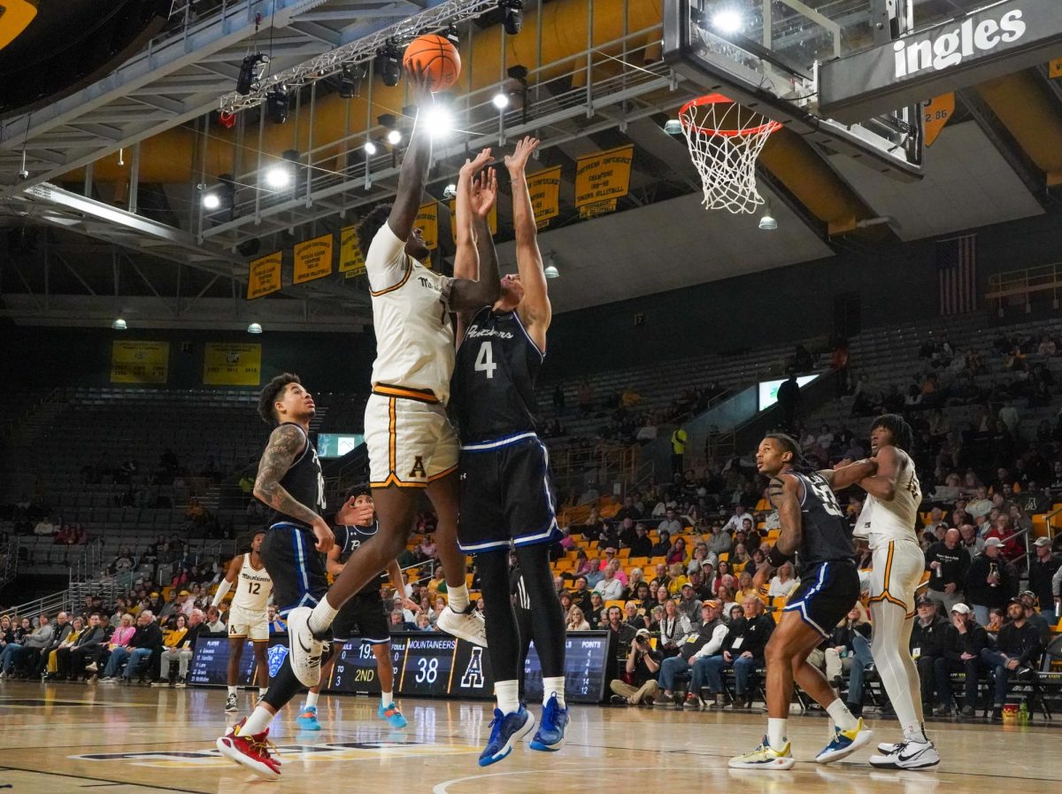 Senior forward Jalil Beaubrun takes a shot against a Panther during the App State vs. Georgia State game on Feb. 1. Beaubrun has a 9.7 points-per-game average for the 2024-25 season.