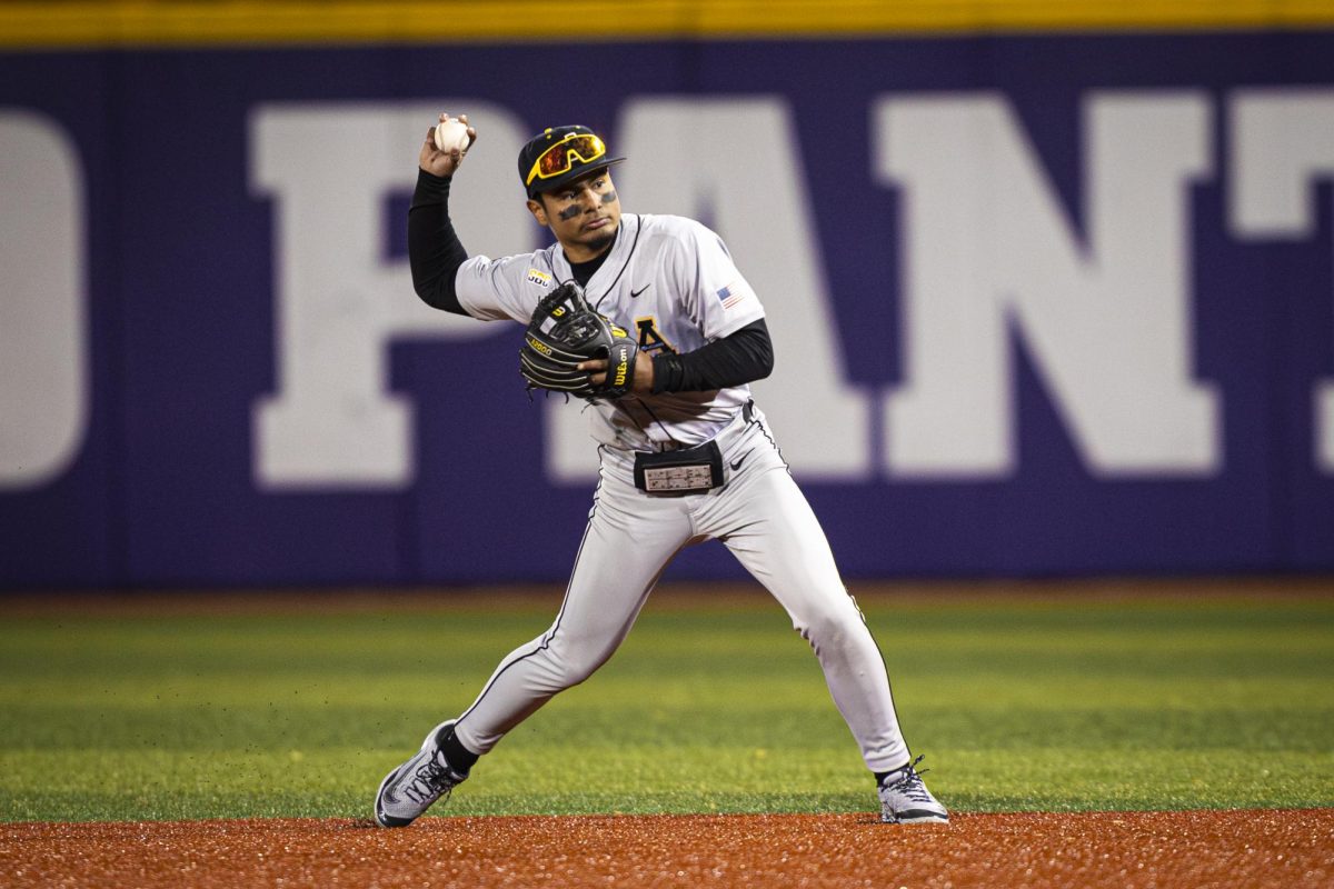 Senior infielder Joseph Zamora throws the ball from shortstop at the App State vs. High Point game on Feb. 18.