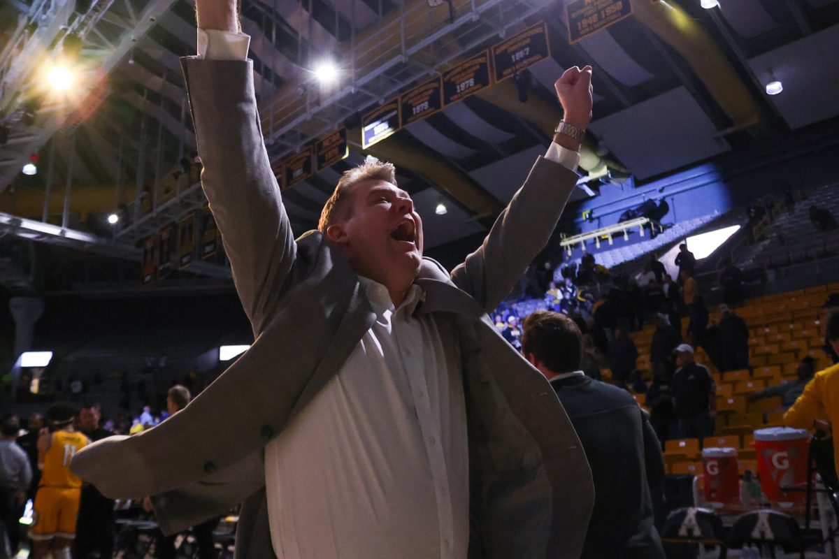 Head coach Dustin Kerns celebrates his team’s buzzer-beater win on Feb. 5 at the Holmes Convocation Center. Kerns led the Mountaineers with a 16-2 Sun Belt record in the 2024 season, marking the best winning percentage in conference play in program history.