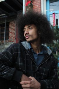 Marques Spencer sits outside of Espresso News on Jan. 14. 