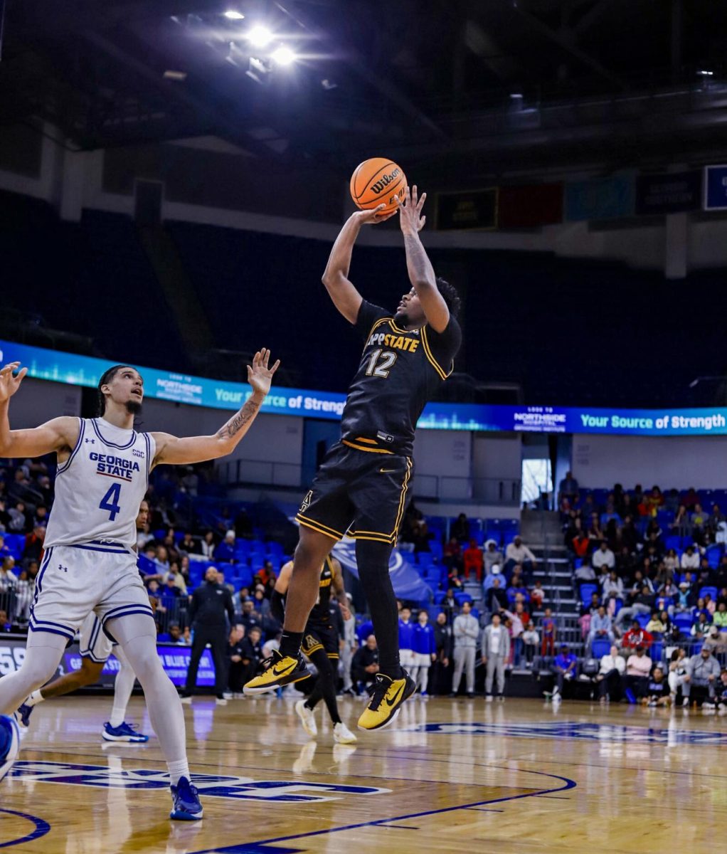 Redshirt senior guard Myles Tate takes a shot against Georgia State at the Georgia State Convocation Center on Feb. 15