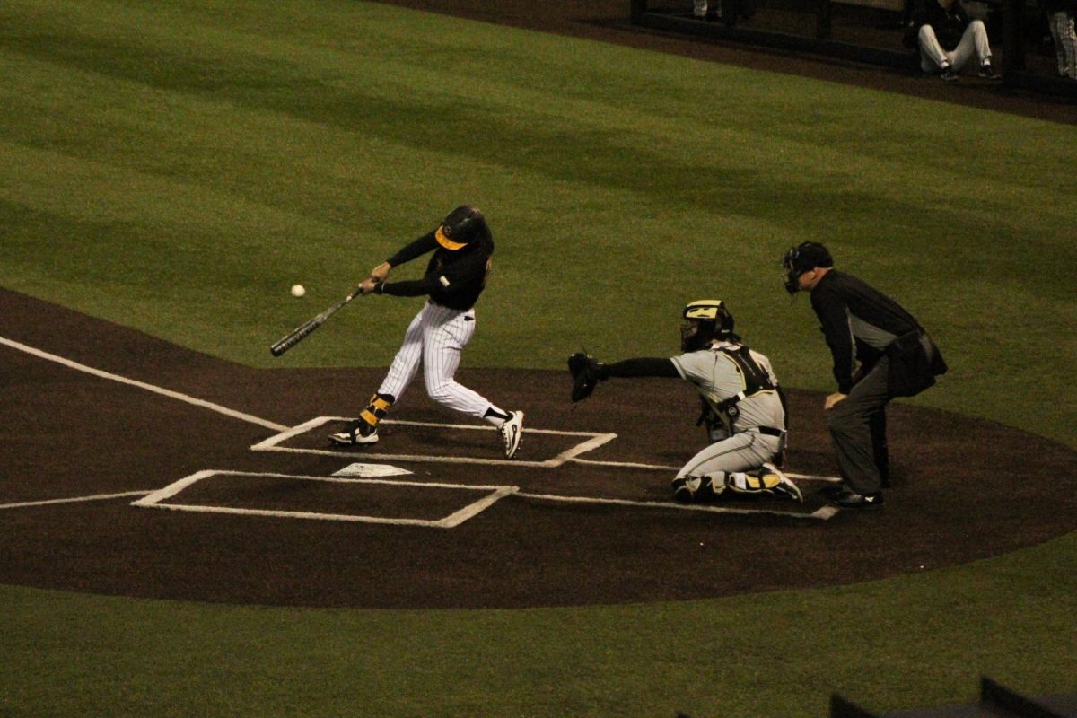 Senior catcher Braxton Church makes contact with the ball for a hit at Beaver Stadium on March 4. 