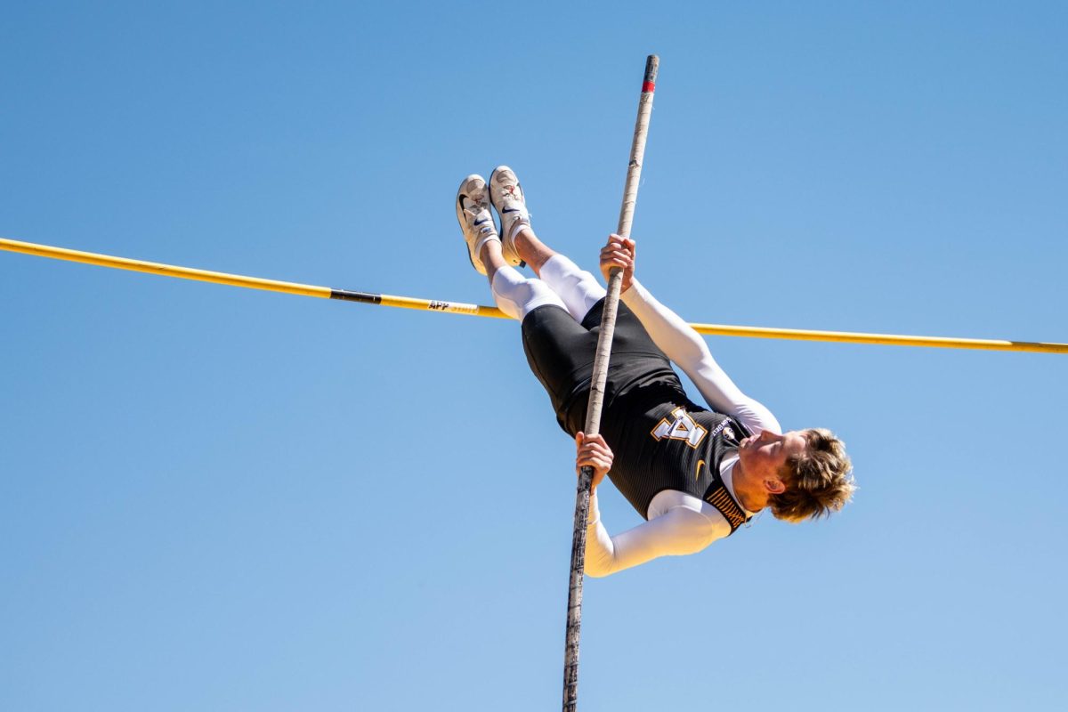 Sophomore Miller Brannen competes in the men’s pole vaulting event on March 21.