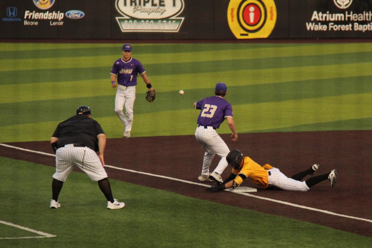 Sophomore infielder Tyler Figueroa slides into third for a triple play at Beaver Stadium on April 18. 
