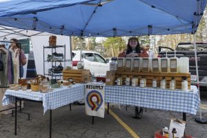 Alexis Hartsell, owner of Resupply Boone, sells soaps and other goods at the Watauga County Farmers’ Market on April 5.