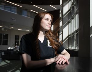 Senior nursing major Kirsten Hafkey sits inside Leon Levine Hall of Health Sciences on April 1.