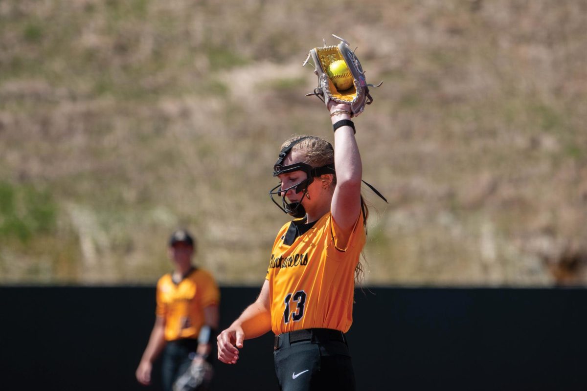 Senior right-handed pitcher Sejal Neas catches the ball between innings during a game against Marshall on April 5. 