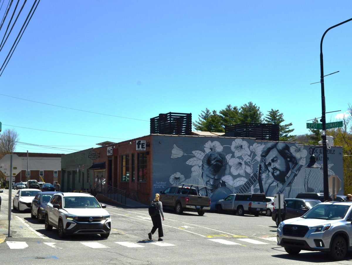 A pedestrian crosses the busy intersection of Howard Street and Depot Street on April 16.