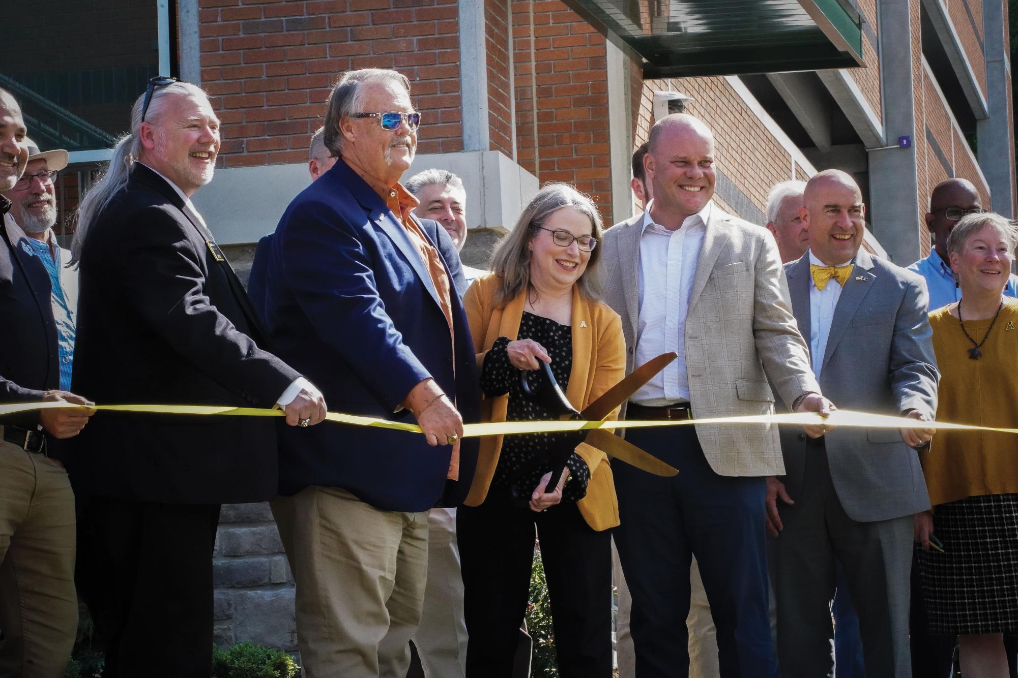 Chancellor Heather Norris cuts the ribbon to celebrate the completion of the Holmes Drive Parking Deck on Aug. 22, 2024.  