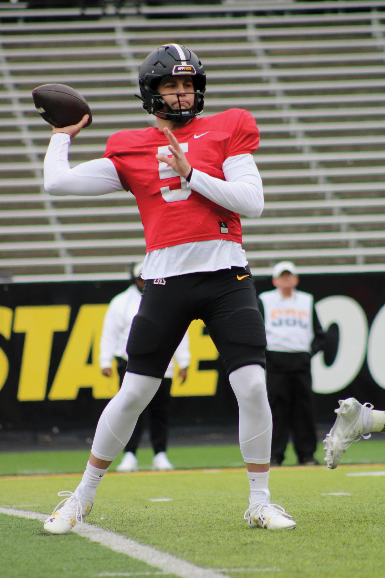 Redshirt junior quarterback AJ Swann winds up for a pass during the Spring Battle at the Rock game on April 12.
